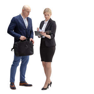 businessman and woman standing and looking at some papers