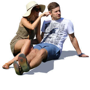 couple sitting in summertime and looking at smth