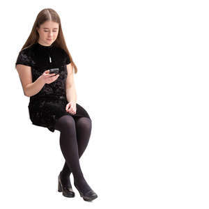 young woman in a black dress sitting