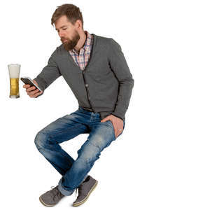 man sitting and drinking beer