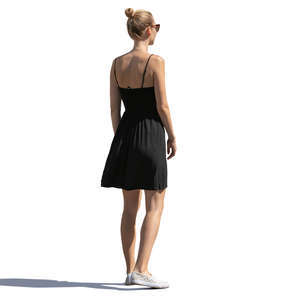 sidelit woman in a black summer dress standing