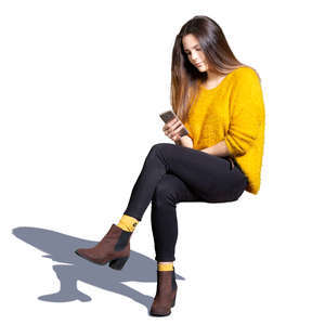 young woman sitting and texting