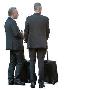 two businessmen with suitcases standing