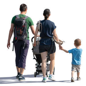 backlit family of three walking