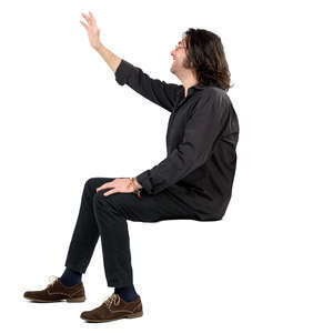 man sitting and waving
