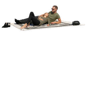 couple lying on a picnic blanket