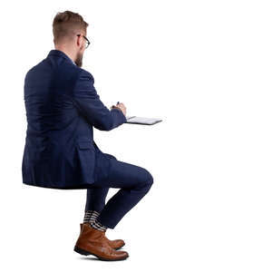 businessman sitting and writing notes