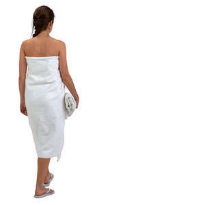 woman wrapped in a spa towel walking
