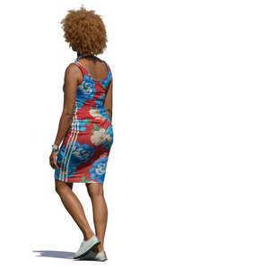black woman in a summer dress walking