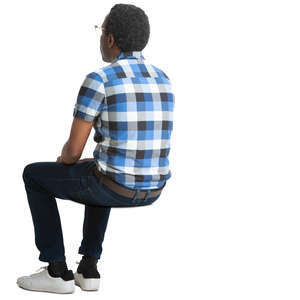 black man in a checkered shirt sitting