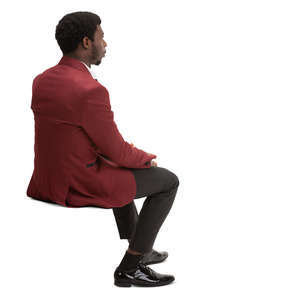 black man in a suit sitting