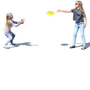 two girls playing frisbee