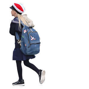 schoolgirl with a school bag walking