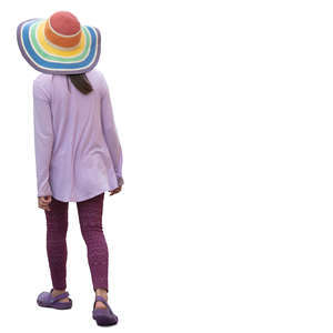 woman in a colorful summer hat walking