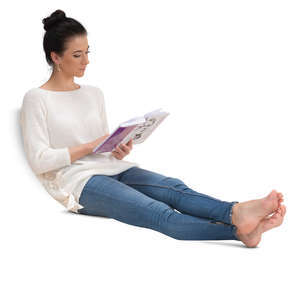 woman sitting on a couch and reading a book