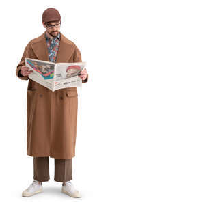 man in a brown overcoat standing and reading a newspaper
