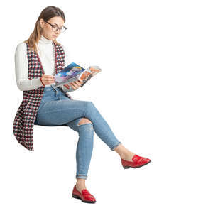 woman sitting and reading a magazine