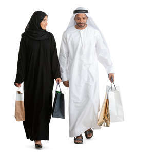 arab man and woman with shopping bags walking