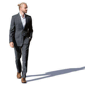 young man in a suit walking