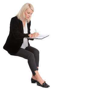 woman writing at the desk
