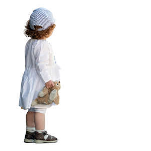 little girl with a toy rabbit standing