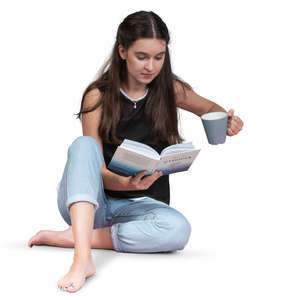 woman sitting on the floor and reading a book