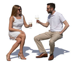 man and woman sitting in a cafe on a summer day