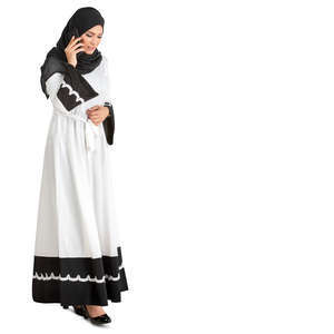 muslim woman walking and talking on the phone