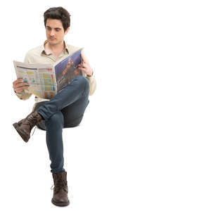man sitting and reading a newspaper