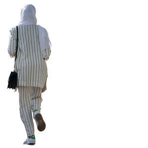 woman with a hijab walking up the stairs