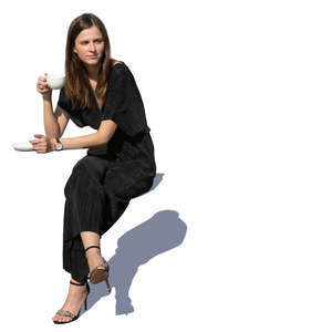 woman sitting and drinking coffee