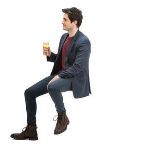 man sitting at a bar and drinking beer