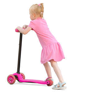 little girl in a pink dress riding a scooter
