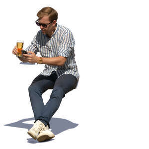 man sitting and drinking beer on a sunny day