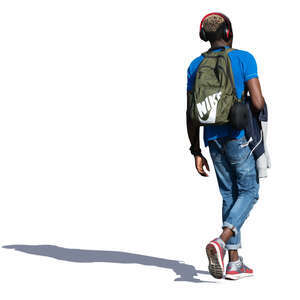 black man with headphones walking