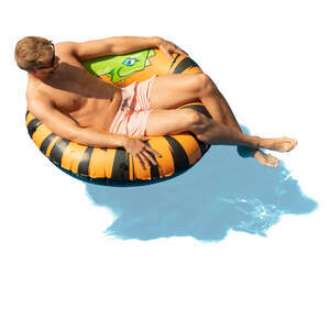 man sunbathing in a large swim ring
