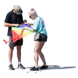 two people preparing to fly a kite