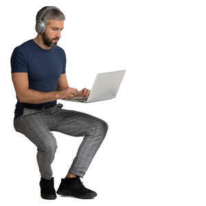 man sitting and working with a computer