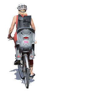 woman driving a bike with a baby in the baby carrier