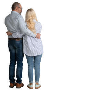 elderly couple standing with arms around each other