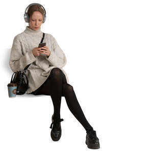 woman sitting and listening to music