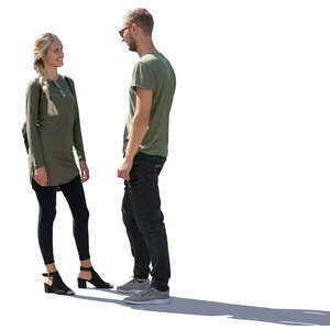 backlit man and woman standing and talking