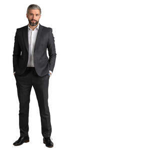 man in a suit standing hands in his pocket