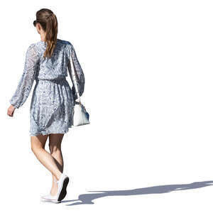 woman in a grey summer dress walking