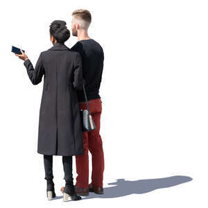 man and woman standing and looking at smth
