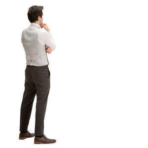 man in a suit standing and looking pensively