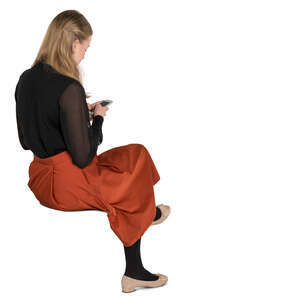 young woman sitting and texting