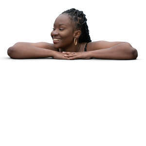 woman leaning on the edge of the pool