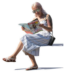woman reading a magazine on a sunny day