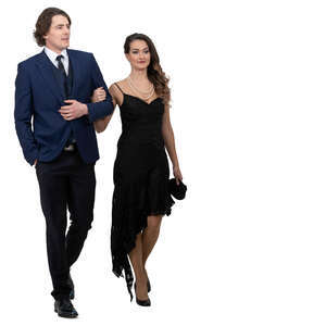 fancy man and woman walking arm in arm